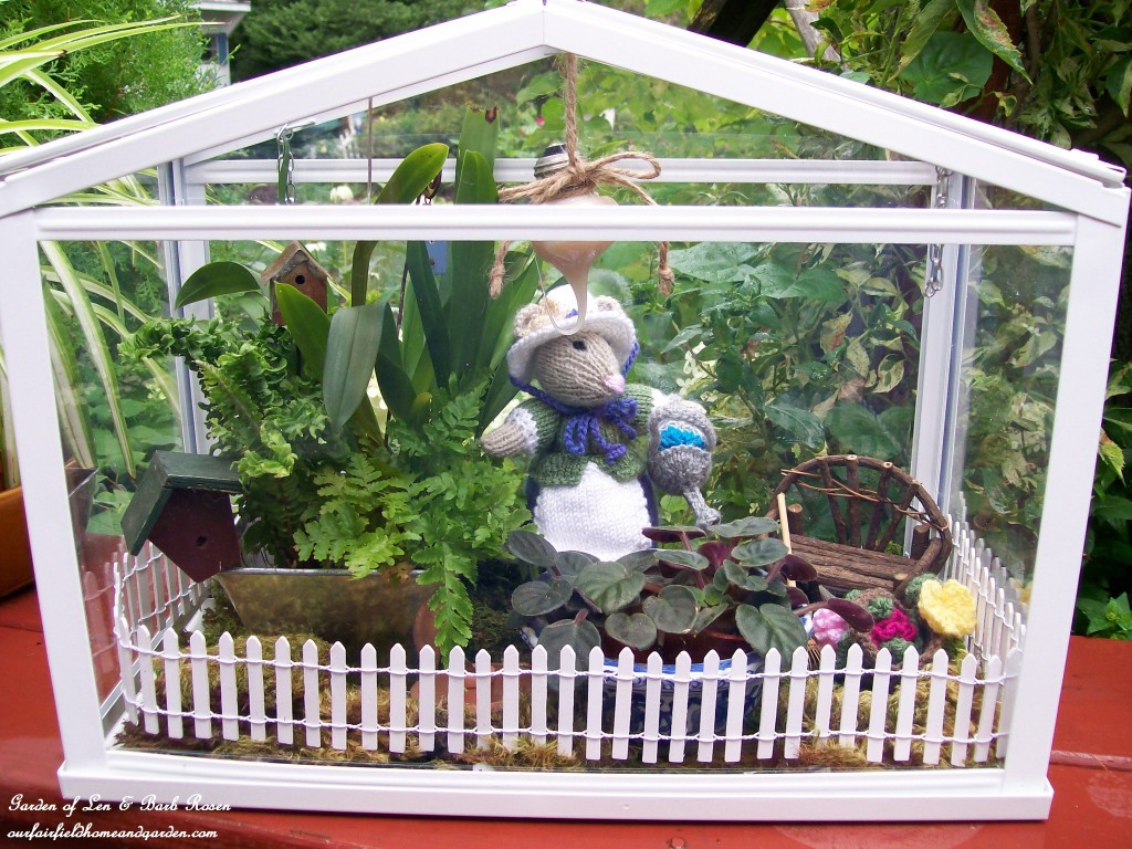Miss Millicent Mouse in her greenhouse. https://ourfairfieldhomeandgarden.com/featured-artist-bonnie-johnson-fabric-artist/
