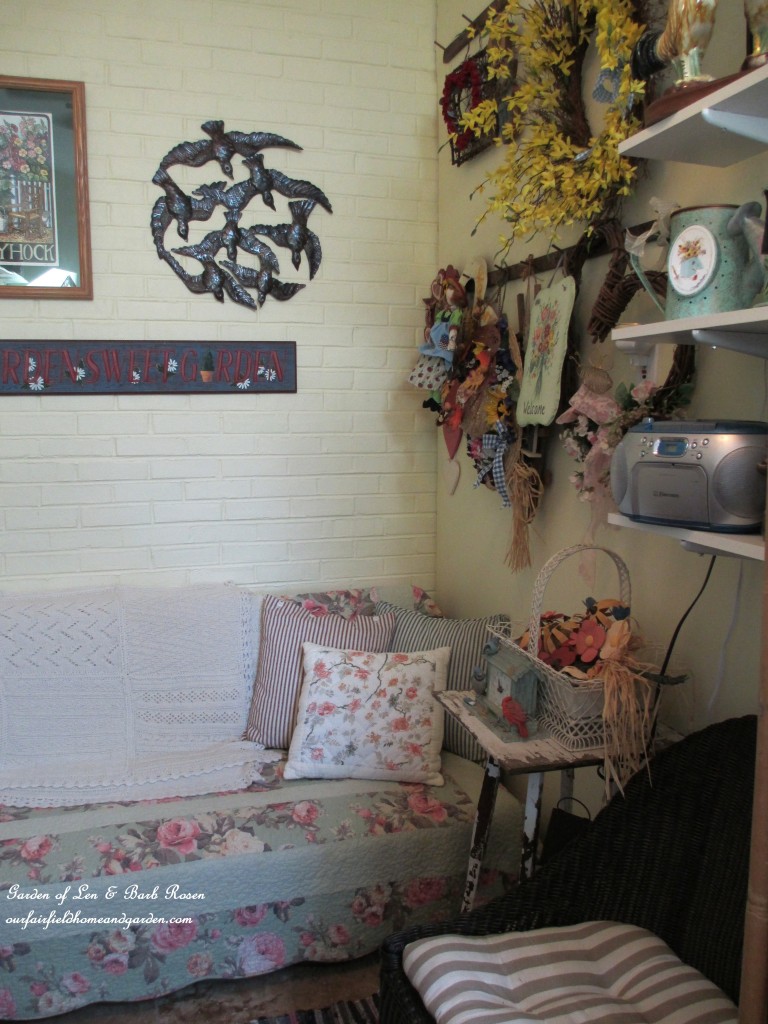 quilt-covered futon for resting & reading https://ourfairfieldhomeandgarden.com/my-winter-sanctuary-scenes-from-a-garden-room/