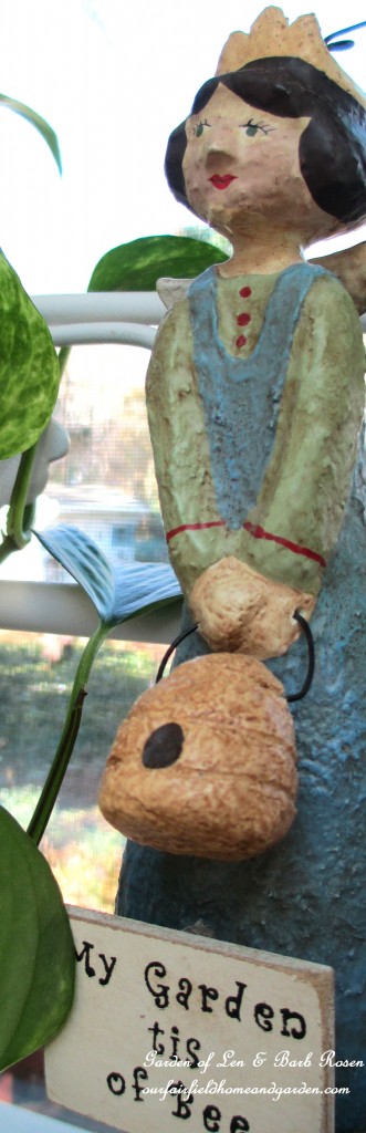 Bee Fairy on the baker's rack https://ourfairfieldhomeandgarden.com/my-winter-sanctuary-scenes-from-a-garden-room/