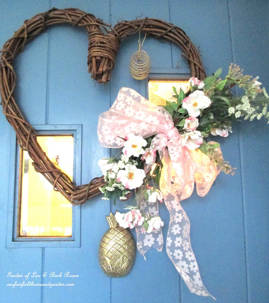 Valentine's wreath on the front door https://ourfairfieldhomeandgarden.com/heart-home-valentines-day-is-coming/