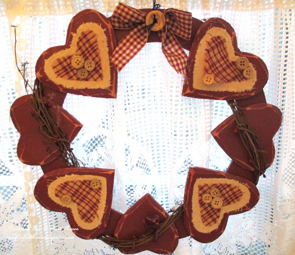 wreath of hearts in the kitchen window https://ourfairfieldhomeandgarden.com/be-my-valentine-valentine-decor/