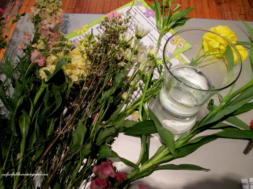materials collected and a vase of fresh water