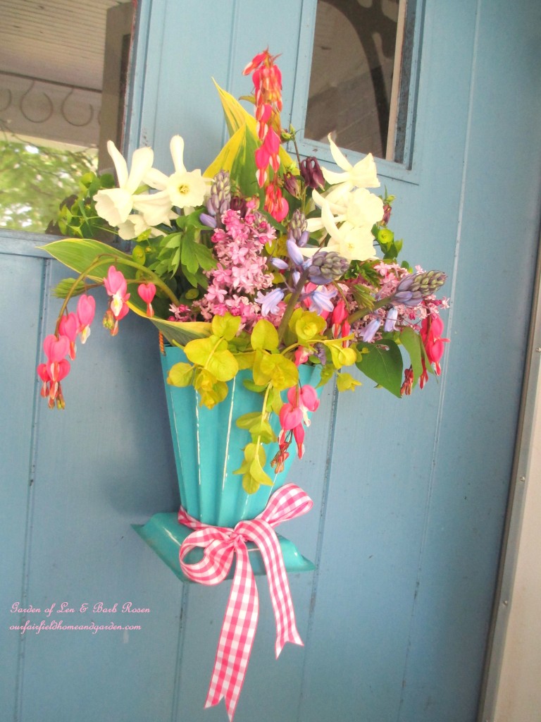 Hang a May Day Basket on your door instead of a wreath! https://ourfairfieldhomeandgarden.com/diy-project-gather-flowers-for-a-may-day-basket/