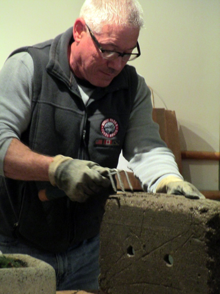 Step # ~ After curing for three days, pop your hypertufa pot out of the mold and rough it up to make it look like natural weathering.