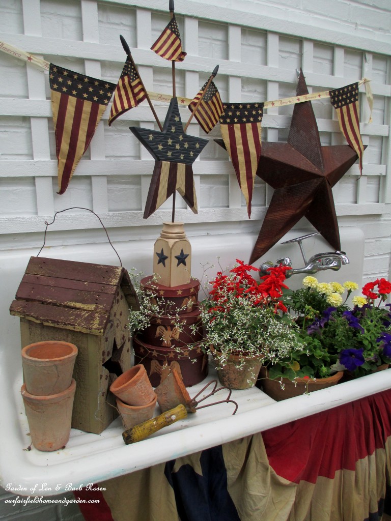The Fourth of July dressing of our vintage potting sink. https://ourfairfieldhomeandgarden.com/happy-4th-of-july-patriotic-potting-sink/