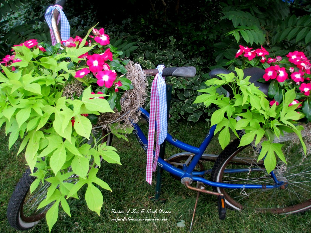 My completed bicycle planter complete with ribbon streamers!https://ourfairfieldhomeandgarden.com/diy-project-my-bicycle-planter/