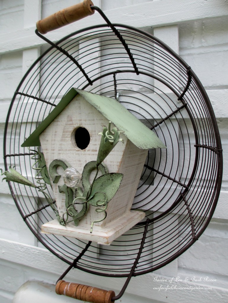 Birdhouse in a wire basket
