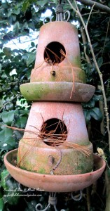 Terra Cotta Birdhouse https://ourfairfieldhomeandgarden.com/its-all-about-the-birds-birdfeeders-birdbaths-and-birdhouses-in-our-garden/