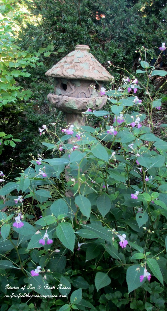 Impatiens Balfourii & the concrete birdhouse https://ourfairfieldhomeandgarden.com/garden-walk-early-fall-garden/