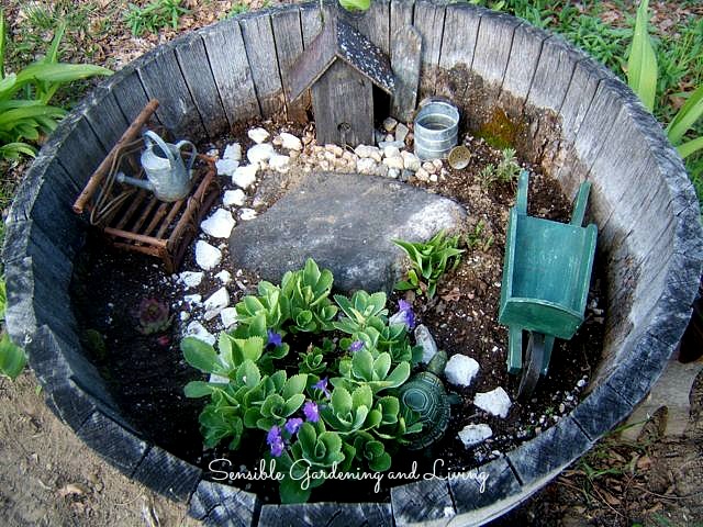 Wooden barrels are excellent for building miniature container gardens. Click to see this one from Sensible Gardening and Living!