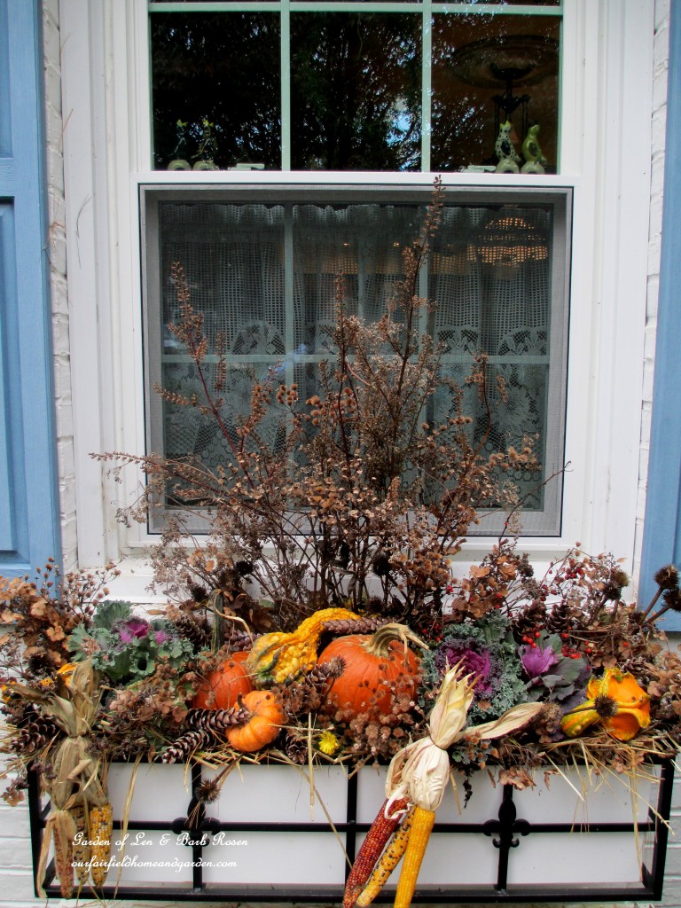 Fall Window Box using seasonal gourds, ornamental kale, Indian corn and dried seed pods & flowers from the garden.