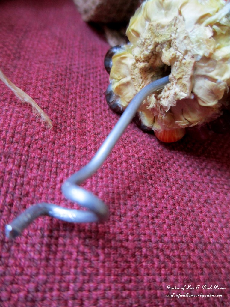 Corn Cob Wreath After breaking the large Indian Corn into thirds, drill a hole through each piece and insert the wire. https://ourfairfieldhomeandgarden.com/diy-fall-corn-cob-wreath/