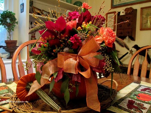 Floral Pumpkin Centerpiece https://ourfairfieldhomeandgarden.com/autumn-garden-accents-inside-and-out/