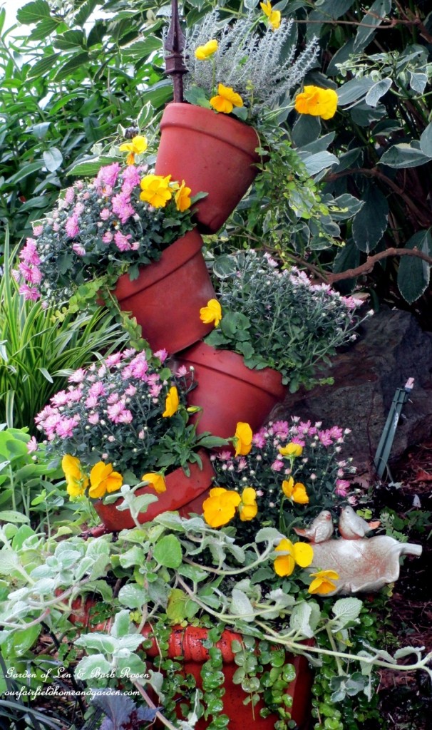 Tipsy-Pots Planter https://ourfairfieldhomeandgarden.com/diy-project-build-your-own-tipsy-pots-planter/