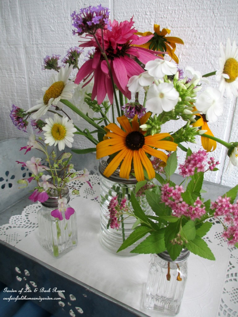 Dollar Store Floral Arrangement https://ourfairfieldhomeandgarden.com/kitschy-kitchen-garden-accents/
