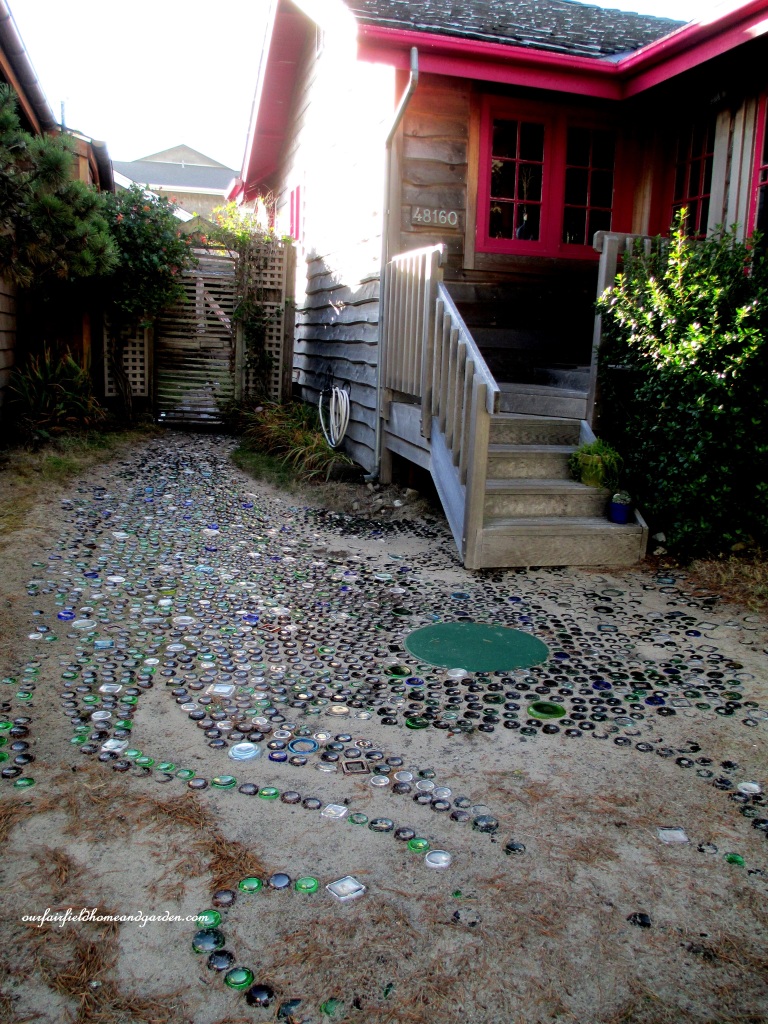 Bottle Garden Path https://ourfairfieldhomeandgarden.com/unexpected-garden-accents/