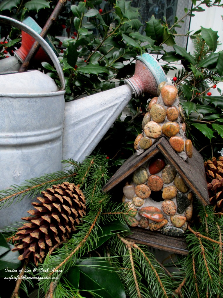 Stone Birdhouse https://ourfairfieldhomeandgarden.com/rustic-watering-cans-windowboxes-more/