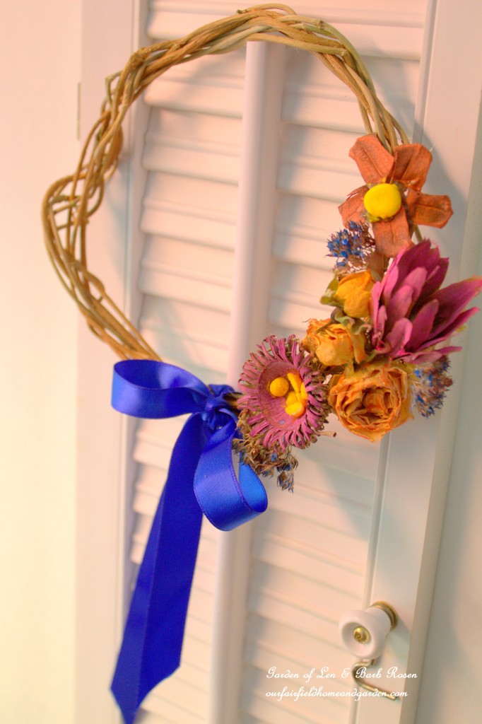 Natural materials wreath enhanced with watercolors. https://ourfairfieldhomeandgarden.com/diy-spring-wreaths/