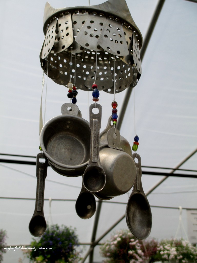 Measuring Cups and Spoons + Steamer Basket = Garden Accent https://ourfairfieldhomeandgarden.com/road-trip-lancaster-county-greenhouses/