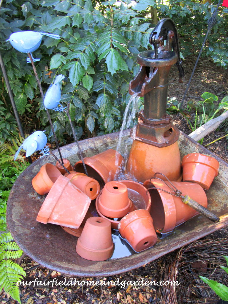 Wheelbarrow Water Feature https://ourfairfieldhomeandgarden.com/wheelbarrow-water-feature/