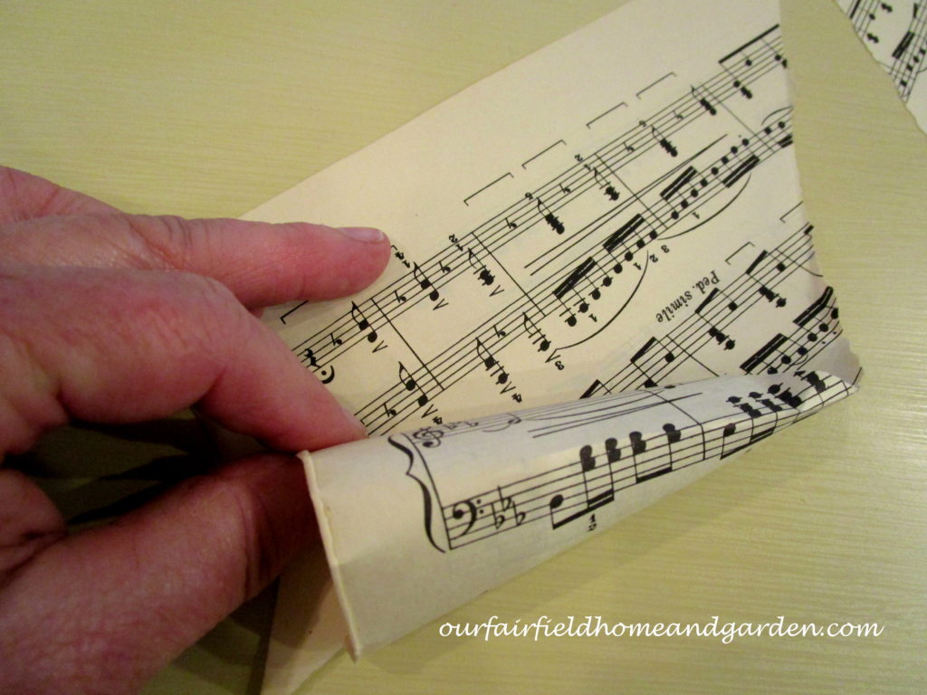Music Sheet Christmas Tree https://ourfairfieldhomeandgarden.com/diy-make-music-sheet-christmas-trees/